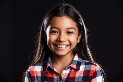 Asian girl smiling in plaid shirt