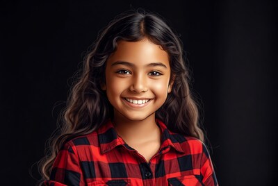 Smiling girl in plaid shirt