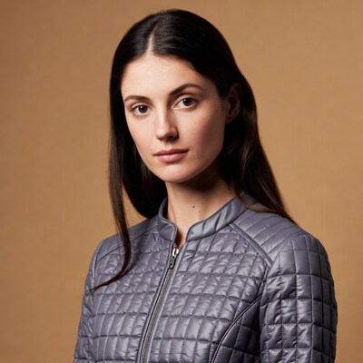 Woman in gray quilted jacket