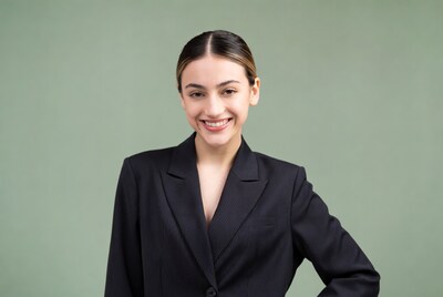 Smiling Latina woman in black blazer