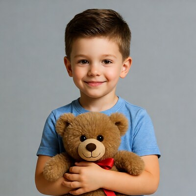 Boy hugging teddy bear