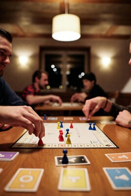 Group playing board game at table