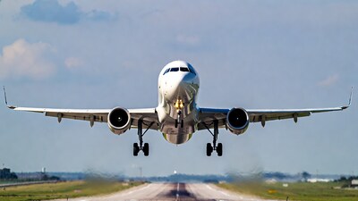 White jet plane landing on runway