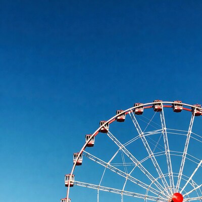 Ferris wheel against blue sky