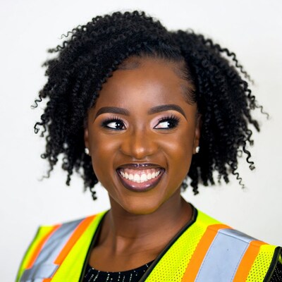 Smiling African woman in safety vest