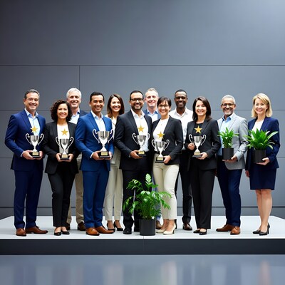 Diverse business team holding trophies