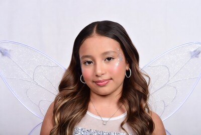 Girl with fairy wings and glitter makeup