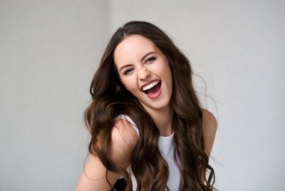 Woman laughing with long brown hair