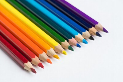 Colorful crayons arranged in rainbow