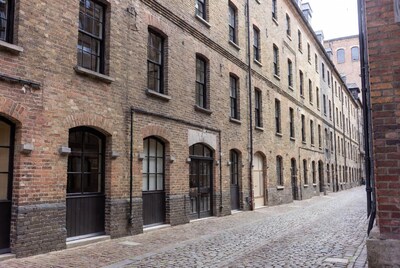 Narrow Cobblestone Alley Brick Buildings