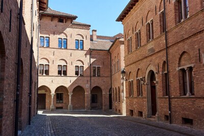 Brick Courtyard with Arched Buildings