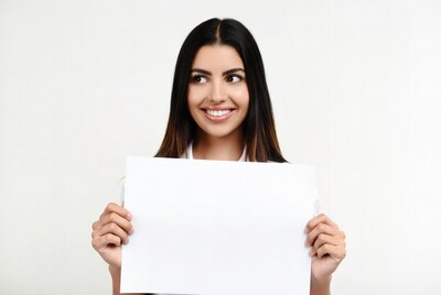 Smiling woman holding blank sign