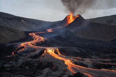 Volcano erupting with lava flows