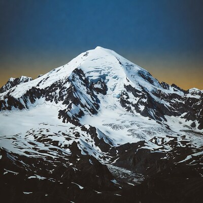 Snowy Mountain Peak at Sunset