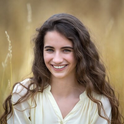 Smiling girl in wheat field