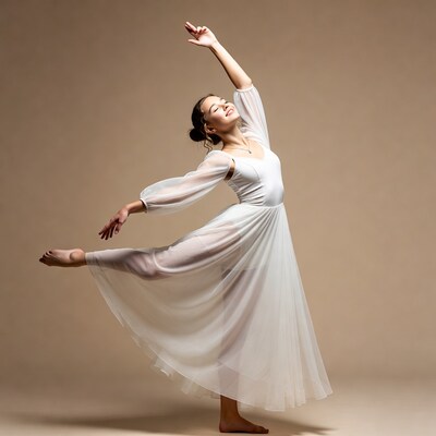 Woman in white flowing dress dancing