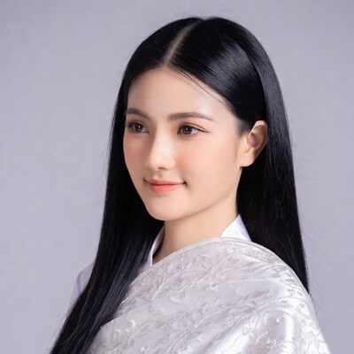 Asian woman in white embroidered áo dài