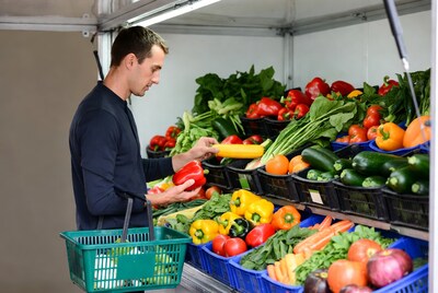 Man shopping for vegetables at market