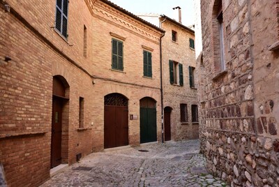 Narrow cobblestone alley in Italian village