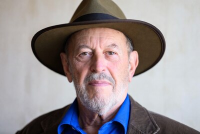 Elderly man wearing fedora hat