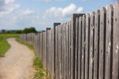 Wooden fence along gravel path