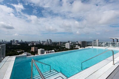 Infinity Pool Over City Skyline