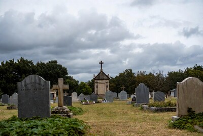 Cemetery Mausoleum with Crosses under Cloudy Sky