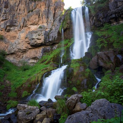 Waterfall cascading over rocky cliffs