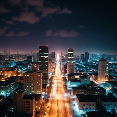 Night skyline with lit boulevard