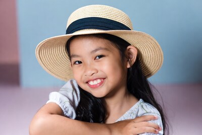 Asian girl smiling in straw hat