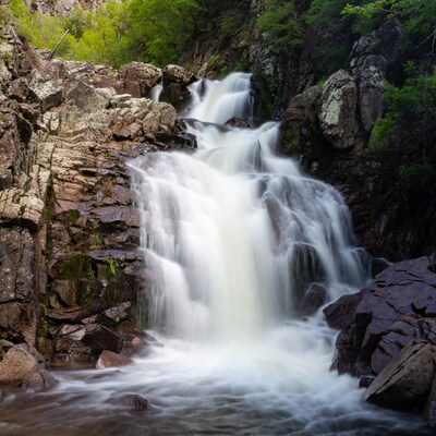 Waterfall cascading over rocky cliffs