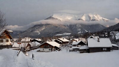 Snowy Alpine Village with Mountains