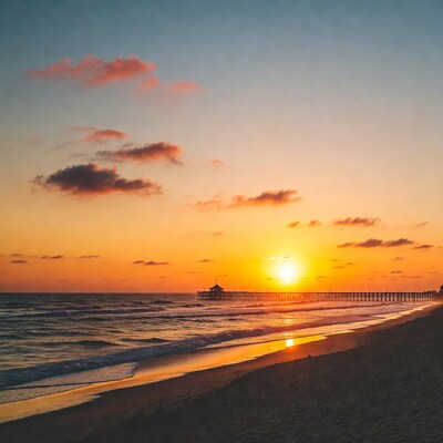 Sunset over pier and beach