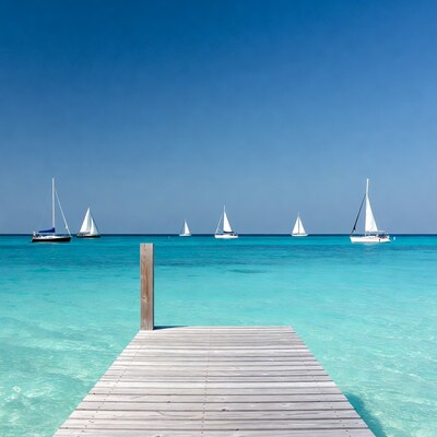 Wooden pier with sailboats in turquoise sea