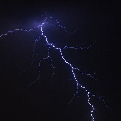 Bright blue lightning bolt in night sky