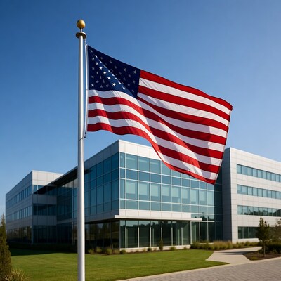 American Flag Waving at Modern Office Building