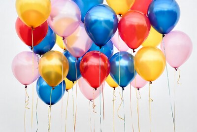 Colorful Balloons Floating on White Background