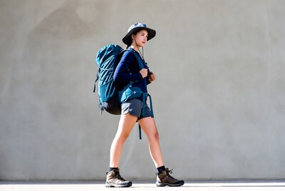 Asian woman hiking with backpack