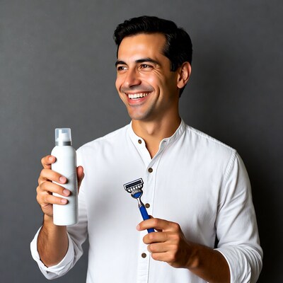 Man holding shaving cream and razor