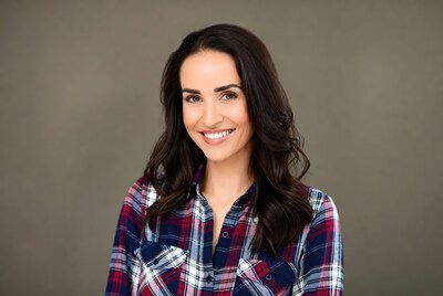 Smiling woman in plaid shirt