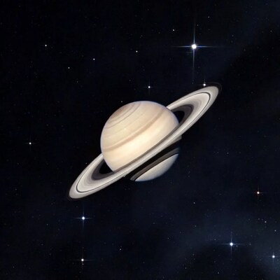 Saturn with rings in starry space