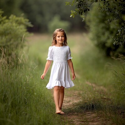 Girl walking barefoot in green field
