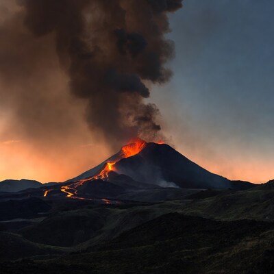 Erupting volcano with lava flows