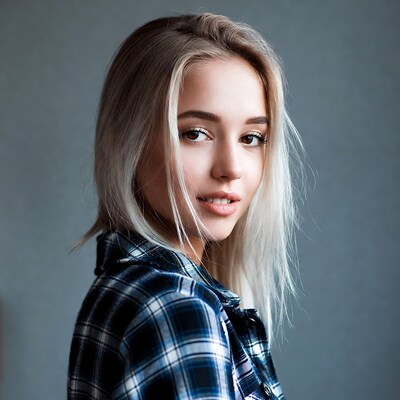 Blonde woman in plaid shirt