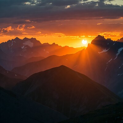 Sunset over Snowy Mountain Peaks