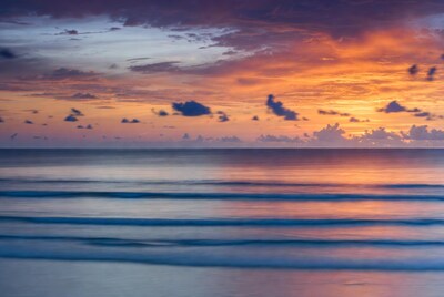Vibrant Ocean Sunset with Long Exposure Waves