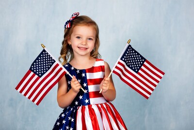 Girl holding American flags
