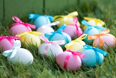 Colorful Easter Eggs with Ribbons on Grass