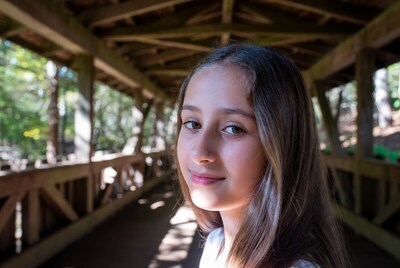 Girl smiling in wooden bridge