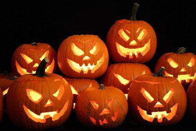 Jack-o'-lantern pumpkins on black background